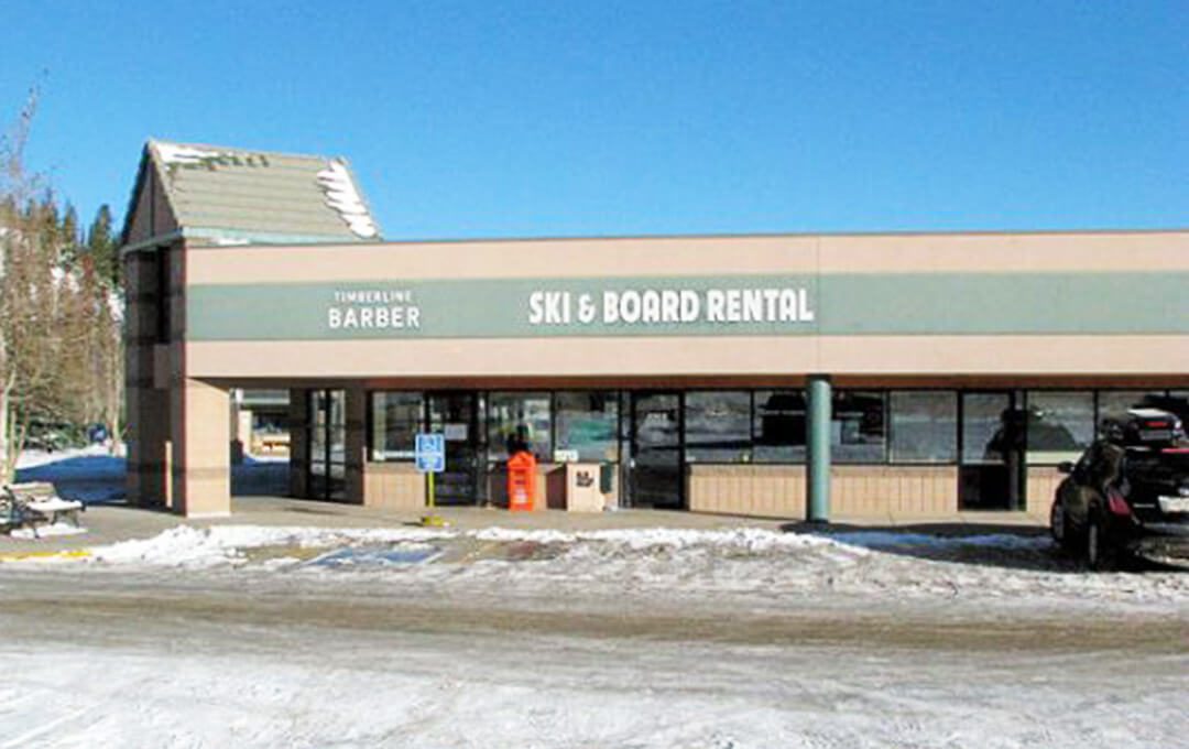 A full shot of the exterior of a ski board rental store