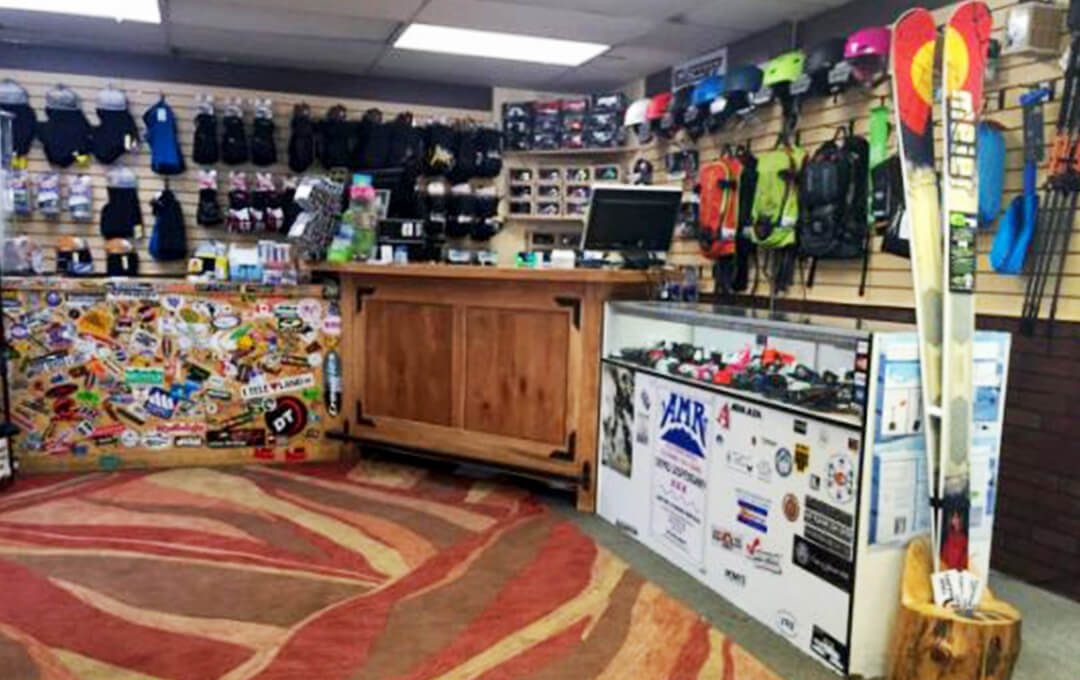 Full shot of the AMR Ski Shop interior with ski equipment for sale and for rent.